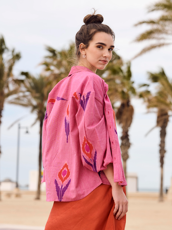 Women in a pink shirt and orange skirt